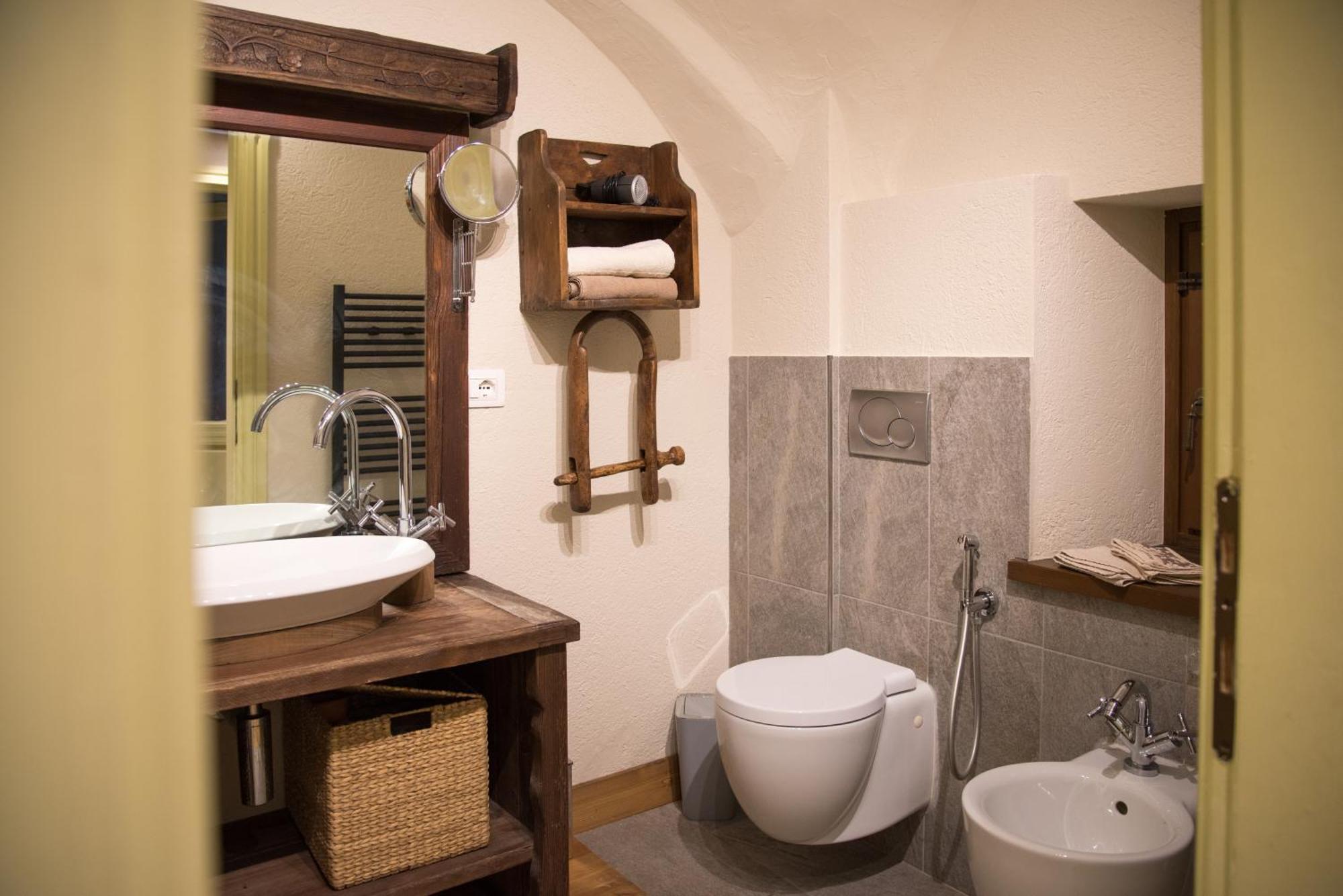 Le Bibelot Apartments Nus Quarto foto