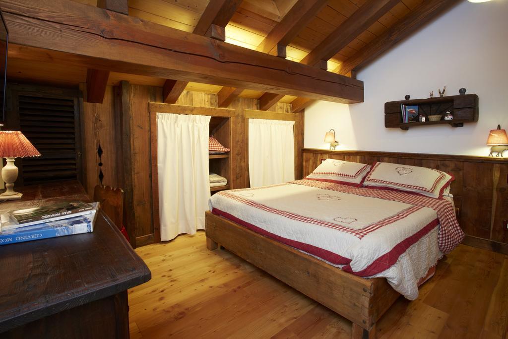 Le Bibelot Apartments Nus Quarto foto